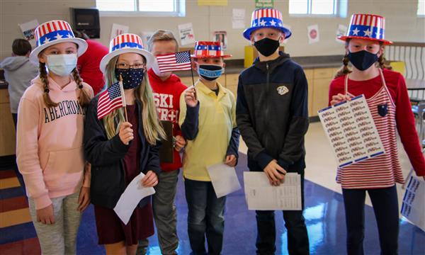 Students dressed as voting volunteers